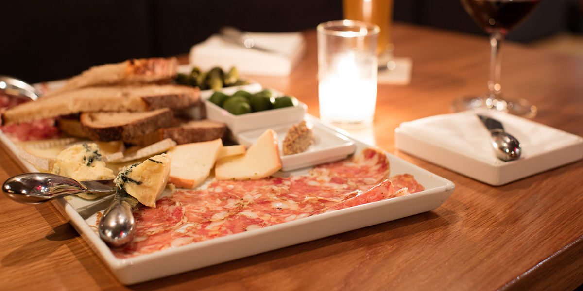 A charcuterie board with wine.